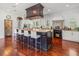 Gourmet kitchen with a large island, custom cabinetry, and built in pizza oven at 124 Estado Ne Way, St Petersburg, FL 33704