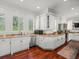 Well-lit kitchen with stainless steel dishwasher, sink, and ample counter space at 124 Estado Ne Way, St Petersburg, FL 33704