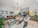 Spacious living room with marble floors, comfortable seating, and decorative accents at 124 Estado Ne Way, St Petersburg, FL 33704