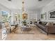 Bright and airy living room featuring modern decor, marble floors, and neutral tones at 124 Estado Ne Way, St Petersburg, FL 33704