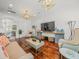 Bright living area with hard wood floors and neutral-toned furniture at 124 Estado Ne Way, St Petersburg, FL 33704