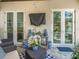 Charming outdoor patio with comfortable seating, blue and white decor, and view of backyard at 124 Estado Ne Way, St Petersburg, FL 33704