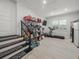 Spacious storage room with tile flooring and a window, offering ample shelving and organization space at 124 Estado Ne Way, St Petersburg, FL 33704