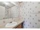 Traditional bathroom featuring a single sink, mirror, and a combined shower and bathtub at 12502 Tocci Ln, Riverview, FL 33579