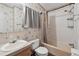 Bathroom with a sink, toilet, shower, and curtain at 12502 Tocci Ln, Riverview, FL 33579