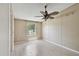 Cozy bedroom with ample natural light, a ceiling fan, and neutral wall paint at 12502 Tocci Ln, Riverview, FL 33579