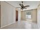 Bedroom with simple decor featuring natural light and a glimpse into a closet at 12502 Tocci Ln, Riverview, FL 33579