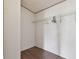 Walk-in closet with wood-look floor and wire shelving at 12502 Tocci Ln, Riverview, FL 33579