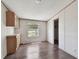 Dining room with wood-look flooring, natural light, and built-in cabinets at 12502 Tocci Ln, Riverview, FL 33579