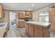 The large kitchen island enhances space while featuring stainless oven and modern laminate flooring at 12502 Tocci Ln, Riverview, FL 33579