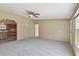 Spacious living room offers neutral walls, ceiling fan, carpet and great light at 12502 Tocci Ln, Riverview, FL 33579