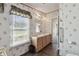Main bathroom with double sinks and light wood cabinets at 12502 Tocci Ln, Riverview, FL 33579