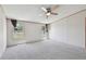 Large main bedroom with neutral carpet, ceiling fan, and bright natural light at 12502 Tocci Ln, Riverview, FL 33579