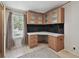 A office area with a built-in desk, storage, and a simple view of the outside at 12502 Tocci Ln, Riverview, FL 33579