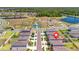 Community aerial view featuring ponds, walking paths, and a playground, near homes at 12950 Pasture Woods Pl, Lithia, FL 33547