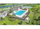 Resort-style swimming pool with poolside seating and lush landscaping offering a perfect spot for relaxation at 12950 Pasture Woods Pl, Lithia, FL 33547