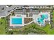 Aerial view of community pool area featuring recreational pool and lap pool at 12950 Pasture Woods Pl, Lithia, FL 33547