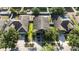 Aerial view of the home shows driveway with parking, mature landscaping, and a well maintained roof at 13653 Artesa Bell Dr, Riverview, FL 33579