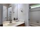 Bathroom with a marble sink, faucet, and an adjacent shower at 13653 Artesa Bell Dr, Riverview, FL 33579