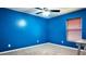 Bedroom with blue walls, gray carpet, and ceiling fan at 13653 Artesa Bell Dr, Riverview, FL 33579