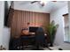 Cozy bedroom with custom wood paneling, perfect for a home office setup at 13653 Artesa Bell Dr, Riverview, FL 33579