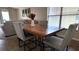 Dining area with wood table and views into the living room at 13653 Artesa Bell Dr, Riverview, FL 33579