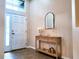 Bright foyer featuring a stylish console table and decorative mirror at 13653 Artesa Bell Dr, Riverview, FL 33579