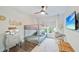 Comfortable bedroom with a bunk bed, decorative accents, a macrame swing chair, and plenty of space at 1407 Jean St, Lutz, FL 33548
