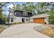 Charming two-story home features a large driveway and a basketball hoop at 1407 Jean St, Lutz, FL 33548