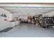 Spacious garage with painted floor, utility sink, lots of storage space and extra room for activities at 1407 Jean St, Lutz, FL 33548