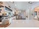 Bright kitchen with white cabinets, stainless steel appliances, quartz countertops and modern finishes at 1407 Jean St, Lutz, FL 33548