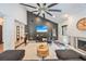 Stylish living room features vaulted ceilings, a cozy fireplace, and comfortable seating arrangement with modern décor at 1407 Jean St, Lutz, FL 33548