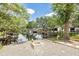 Beautiful waterfront property featuring a fire pit and stunning views of the lake and boathouses at 1407 Jean St, Lutz, FL 33548