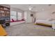 Comfortable bedroom with carpeting, built-in window seat, and a vaulted ceiling at 1501 Wisconsin Ave, Palm Harbor, FL 34683