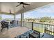 Spacious balcony with outdoor seating, ceiling fan, and scenic water views at 16025 Redington Dr, Redington Beach, FL 33708