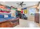 Spacious bedroom with natural light, ceiling fan, and plenty of closet space at 16025 Redington Dr, Redington Beach, FL 33708