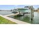 A modern boat lift and dock setup perfect for protecting and easily accessing your boat and jet ski on the water at 16025 Redington Dr, Redington Beach, FL 33708
