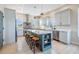 Modern kitchen with stainless steel appliances, a stylish island with seating, and ample cabinet space at 16025 Redington Dr, Redington Beach, FL 33708