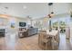 Open-concept living area with dining space and a view of the porch through sliding glass doors at 16025 Redington Dr, Redington Beach, FL 33708