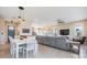 Open floor plan with living, dining, and kitchen area features luxury vinyl plank flooring at 16025 Redington Dr, Redington Beach, FL 33708