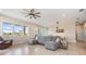 Spacious living room features large windows with lots of natural light and an open floorplan at 16025 Redington Dr, Redington Beach, FL 33708