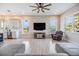 Bright and airy living room with large windows, casual furnishings, and recessed lighting at 16025 Redington Dr, Redington Beach, FL 33708