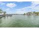Beautiful waterfront view of docks, water, and blue skies at this Redington Beach home at 16025 Redington Dr, Redington Beach, FL 33708