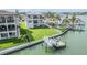 Stunning waterfront property with a private dock and boat lift, perfect for enjoying the water views at 16025 Redington Dr, Redington Beach, FL 33708