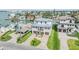 Beautiful two-story waterfront home with lush landscaping, private dock and charming curb appeal at 16025 Redington Dr, Redington Beach, FL 33708