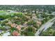 Aerial view of a neighborhood with a pond and baseball field at 1693 Fry Ct, Dunedin, FL 34698