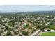 Panoramic aerial view of the community, highlighting nearby beaches, and lush green landscape at 1693 Fry Ct, Dunedin, FL 34698