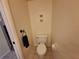Modern bathroom with toilet and towel holder at 1693 Fry Ct, Dunedin, FL 34698
