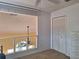 Bedroom featuring a spacious layout, upper loft view, and a closet for ample storage at 1693 Fry Ct, Dunedin, FL 34698