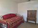 Bedroom featuring a bed and an antique-looking hutch at 1693 Fry Ct, Dunedin, FL 34698